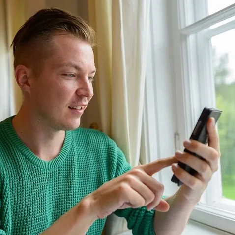 Man using mobile in Finland